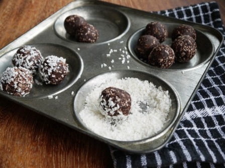 Date Truffles rolled in coconut with a metal baking dish, one of my 25 Homemade Christmas Gift Ideas