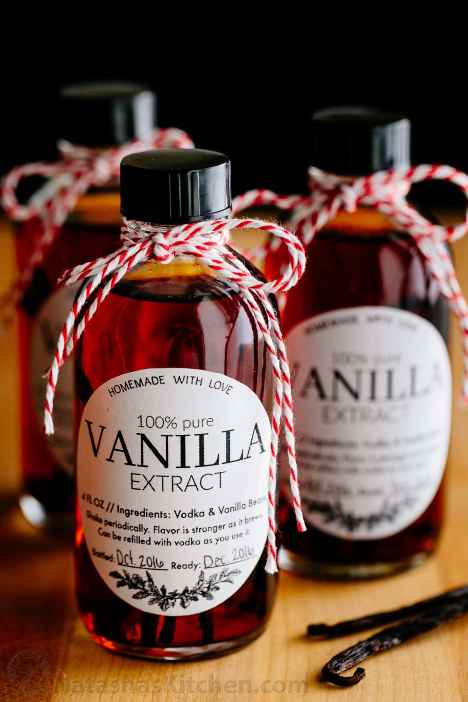 Sweet festive bottles of homemade vanilla extract with red and white string