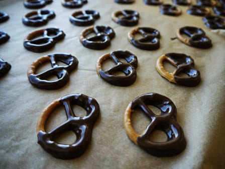  Pretzels with dark chocolate on a piece of brown baking paper, one of my 25 Homemade Christmas Gift Ideas