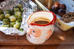 Christmas dinner leftovers: Brussel sprouts, vegetables and gravy in a Father Christmas jug