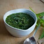 Small heart shaped white bowl filled with home made mint sauce