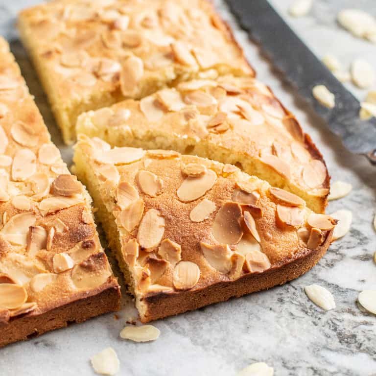 freshly baked almond slice on marble surface 