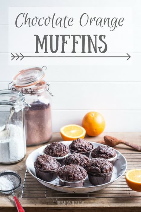 Chocolate Orange Muffins on a white plate surrounded by baking products