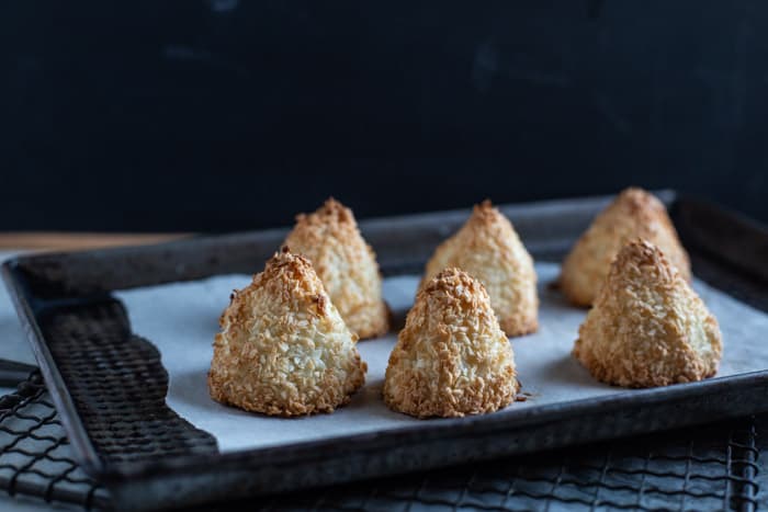 little coconut pyramids on a baking sheet lined with baking paper