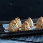 little coconut pyramids on a baking sheet lined with baking paper