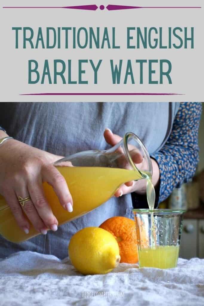 Woman pouring an old fashioned homemade barley water from a glass carafe into a small glass