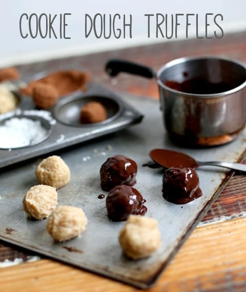 Cookie Dough Truffles on a baking sheet with melted chocolate, one of my 25 Homemade Christmas Gift Ideas