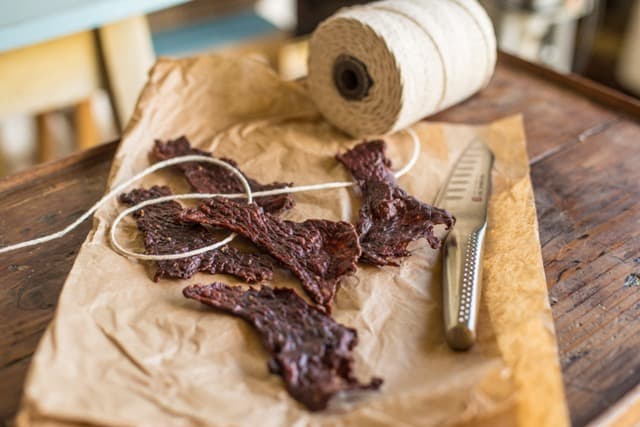 Salt & Pepper Jerky on a piece of brown paper with butchers twine, one of my 25 Homemade Christmas Gift Ideas