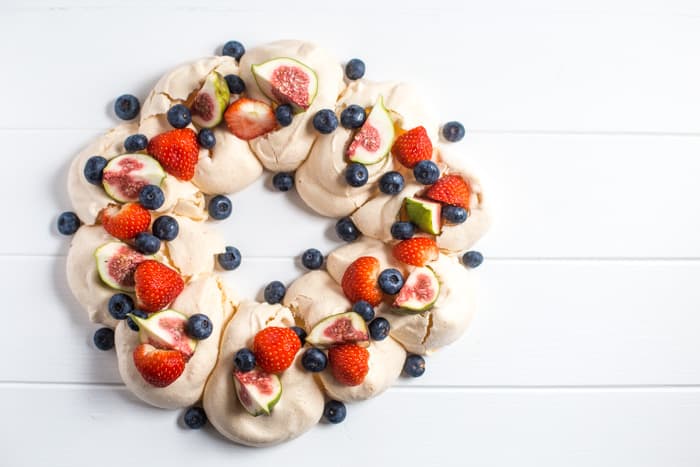 Meringue Wreath with fresh berries and figs on white background, one of my 25 Homemade Christmas Gift Ideas