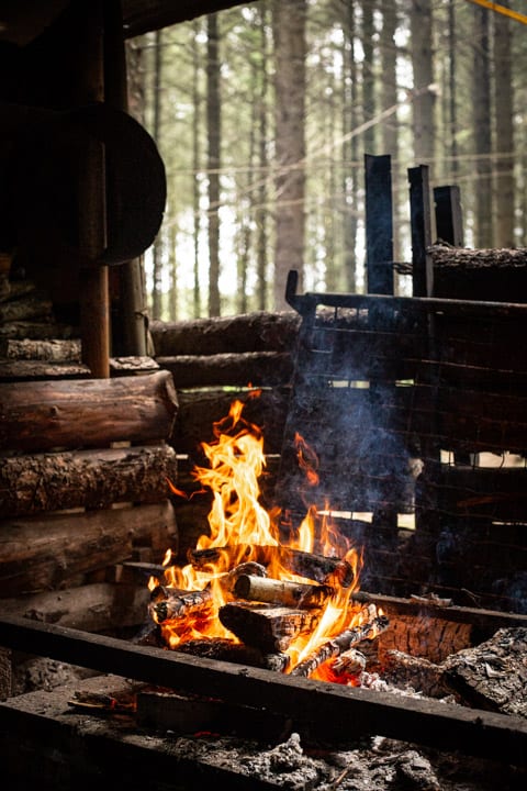 campfire flames burning in an outdoor kitchen