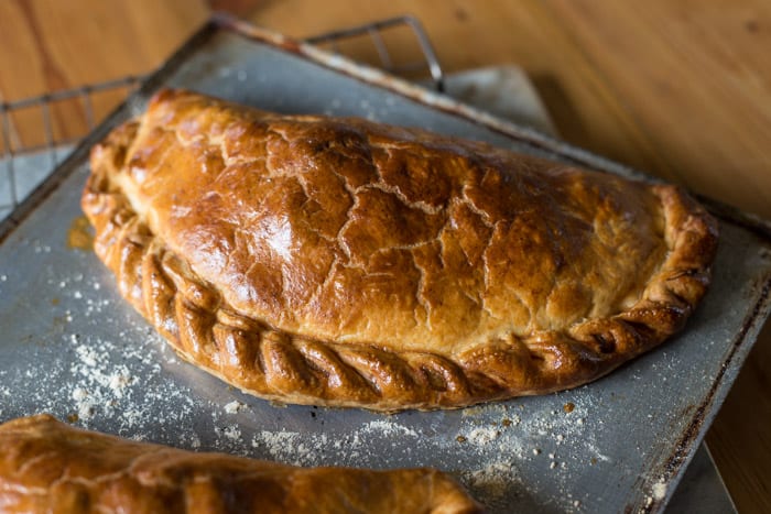 Tenderstem and Cornish Blue Cheese Pasty on a baking tray just out of the oven