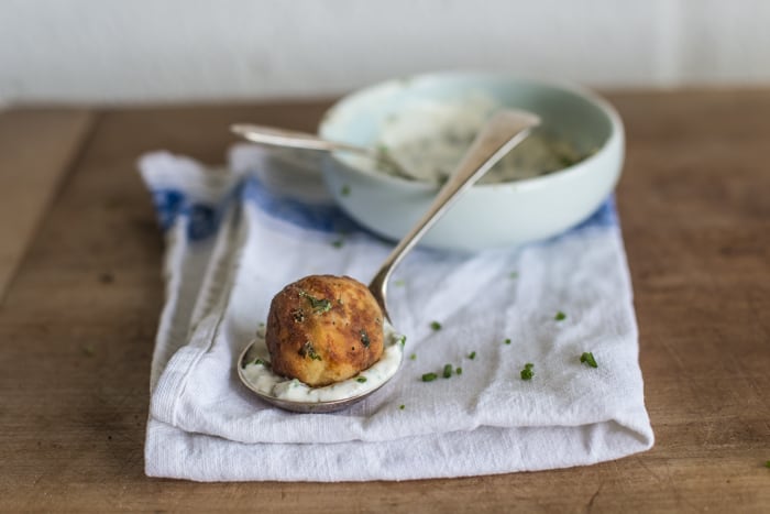 Crispy Fish Balls with Easy Tartare Sauce served on a teaspoon on a white cloth