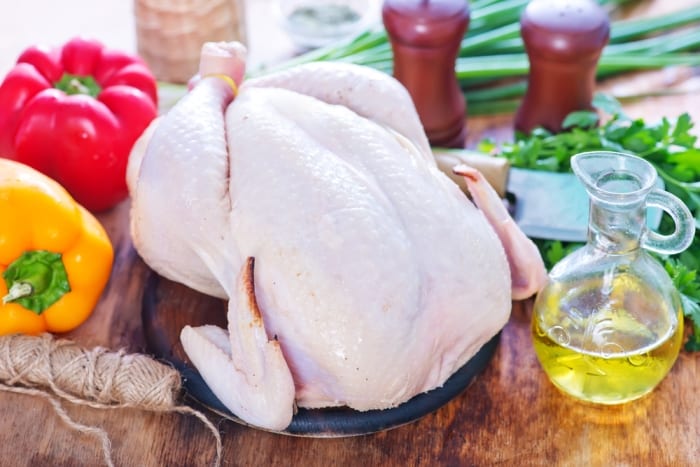 How to Safely Cook Turkey Turkey on a kitchen table with peppers and oil