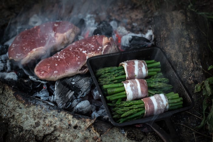 Asparagus and dirty steak cooking on an campfire for Festive Dirty Steak Salad