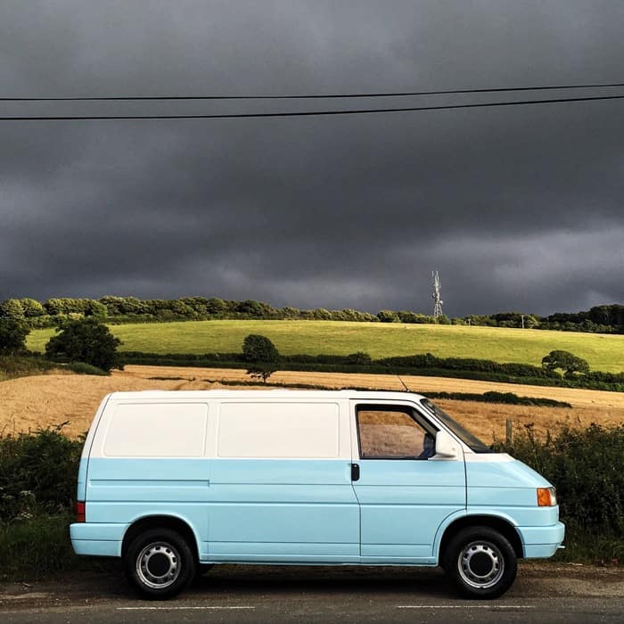 VW T4 after restoration with storm clouds behind