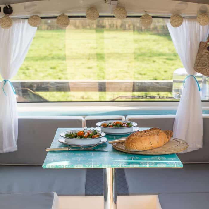 My Self Build VW T4 Campervan Conversion - a meal for 2 set out on the table by a window