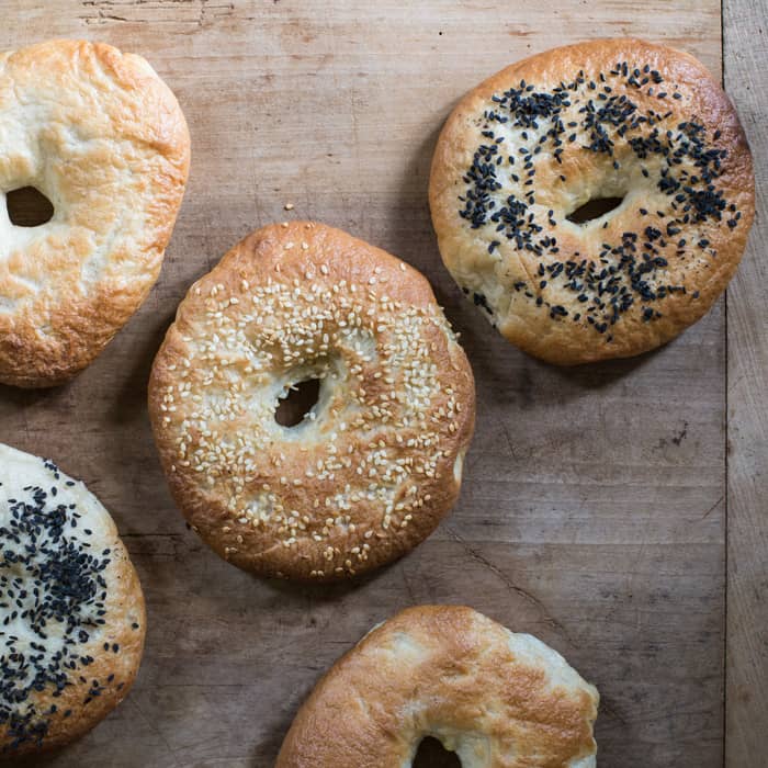 Home made wonky bagels with poppy seed and sesame seed toppings from New York Bagel Recipe