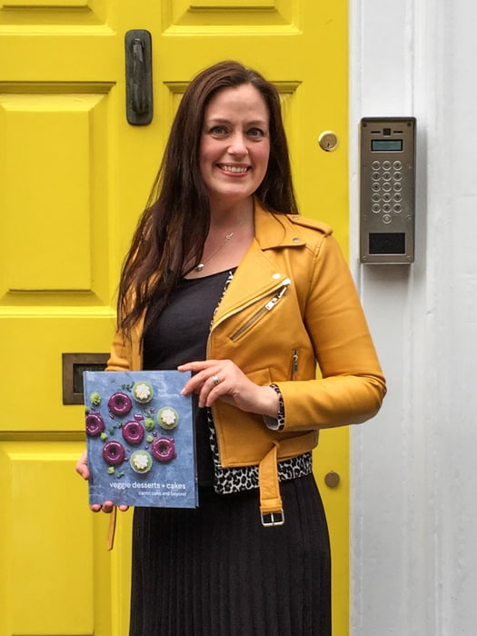 Katherine Hackworthy (aka Veggie Desserts) holding her debut cookbook