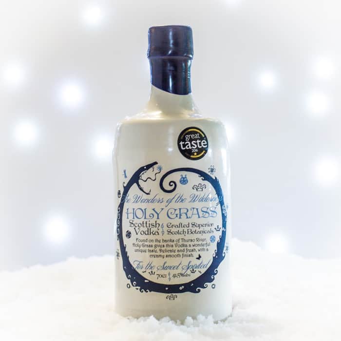 White and blue bottle of Holy Grass Vodka 