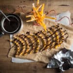 Freshly made Candied Orange Peel being drizzled with melted dark chocolate