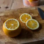 Cutting the oranges to make Candied Orange Peel