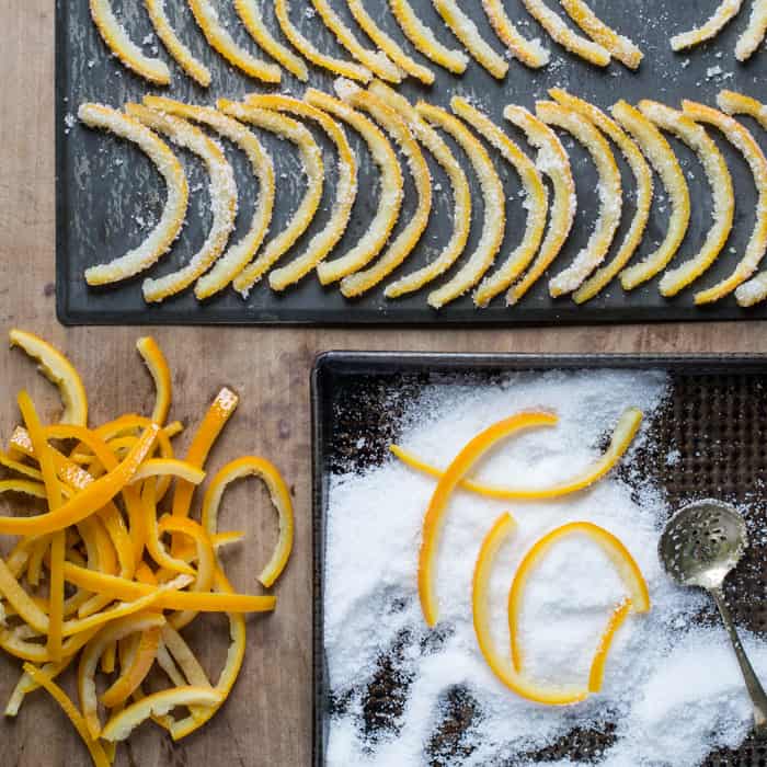 Coating the candied orange peel in granulated sugar