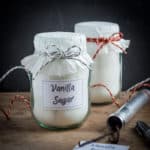 Pretty jars of homemade vanilla sugar to give as gifts