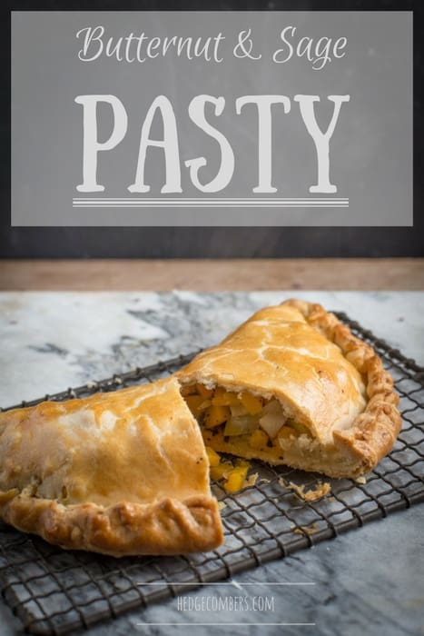 A freshly baked butternut and sage pasty being cut open