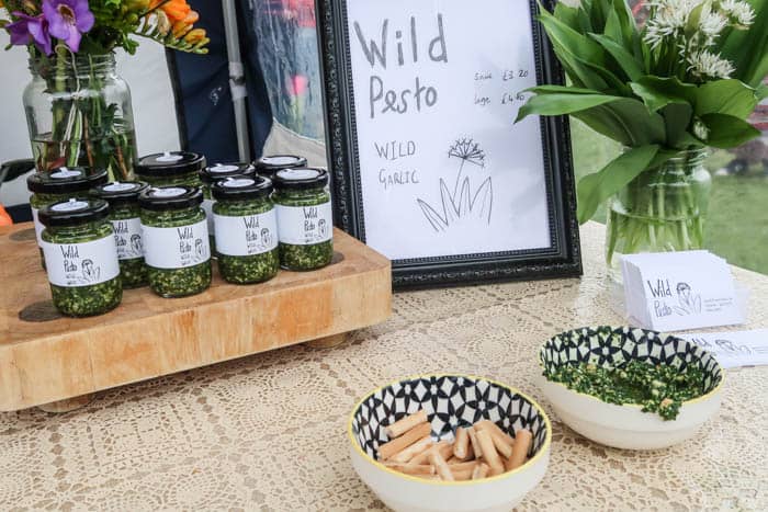 Table with jars of wild garlic pesto for sale