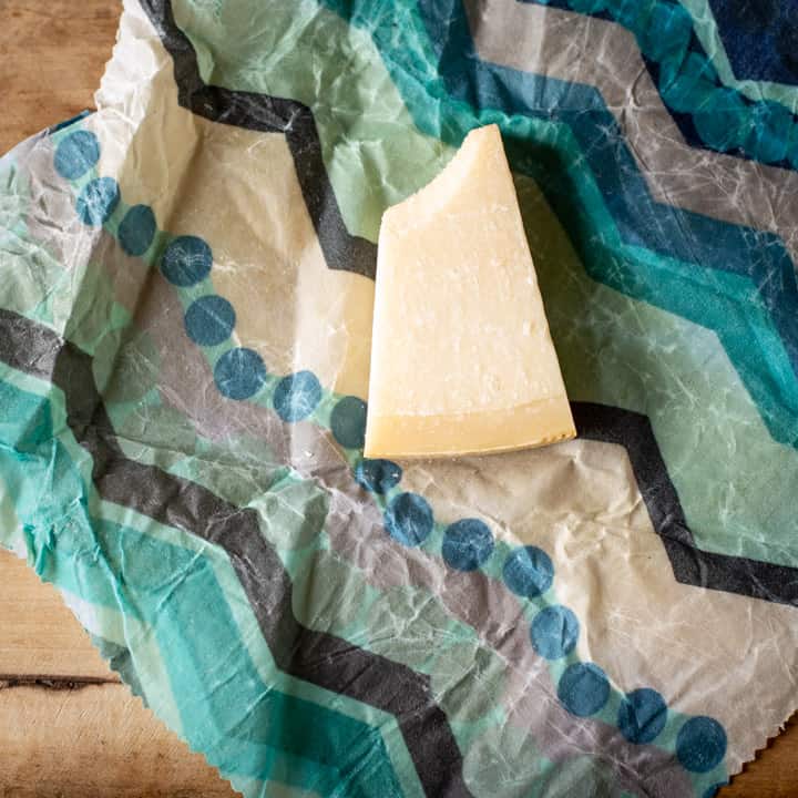 half a block of parmesan cheese laid on diy beeswax wraps