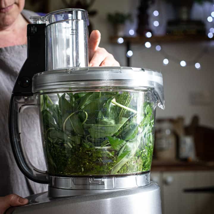 a food processor full of wild garlic ready to make ramson pesto