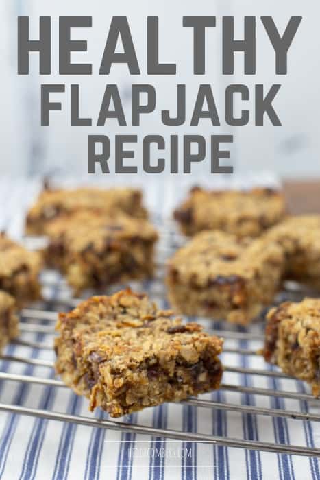 healthy flapjack squares on a metal cooling rack on top of stripey fabric