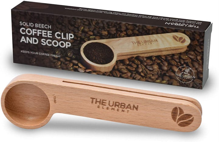 wooden coffee scoop and bag clip against a white background