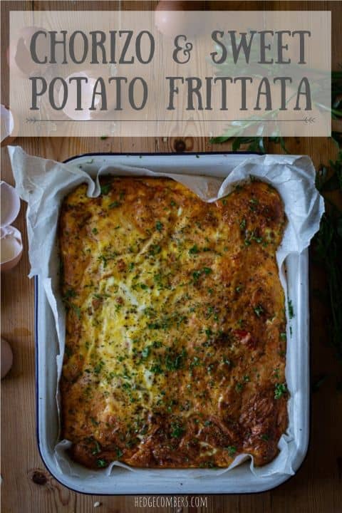 white baking tin of chorizo and sweet potato frittata on a wooden surface