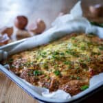 warm chorizo frittata on a wooden surface