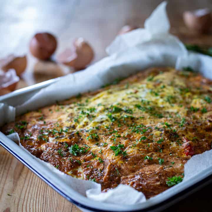 warm chorizo frittata on a wooden surface