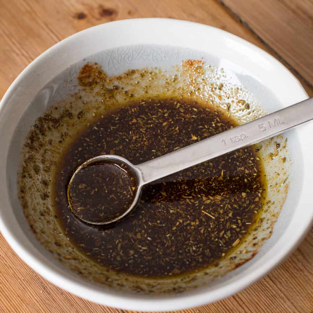 A small grey bowl of easy homemade chicken marinade