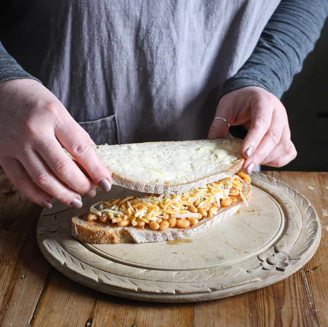 Top slice being placed on sourdough toasty